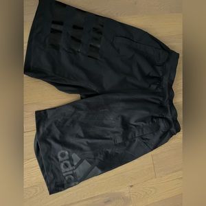 Adidas shorts with side pockets.